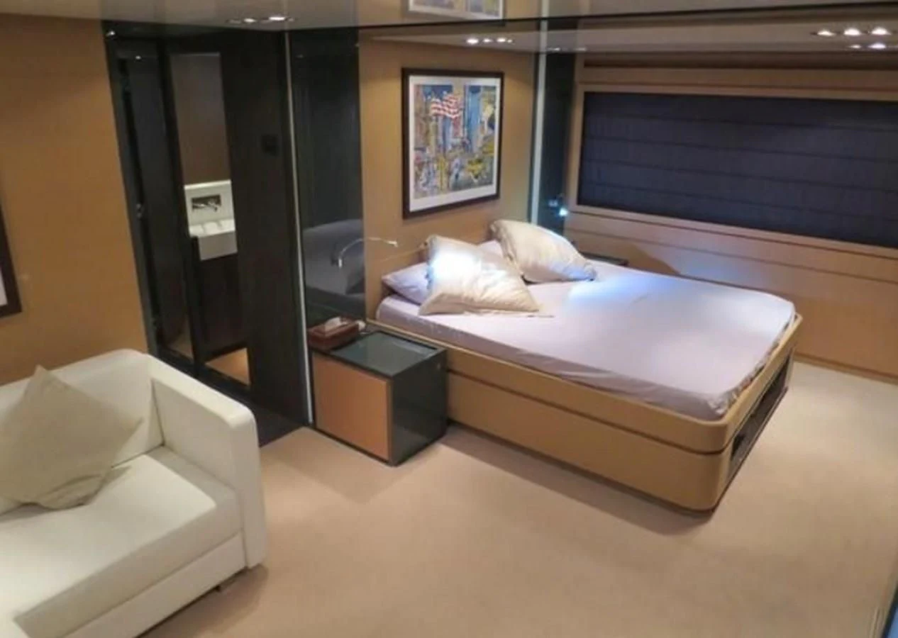 a bed in a room aboard RIVA 86 DOMINO Yacht for Sale