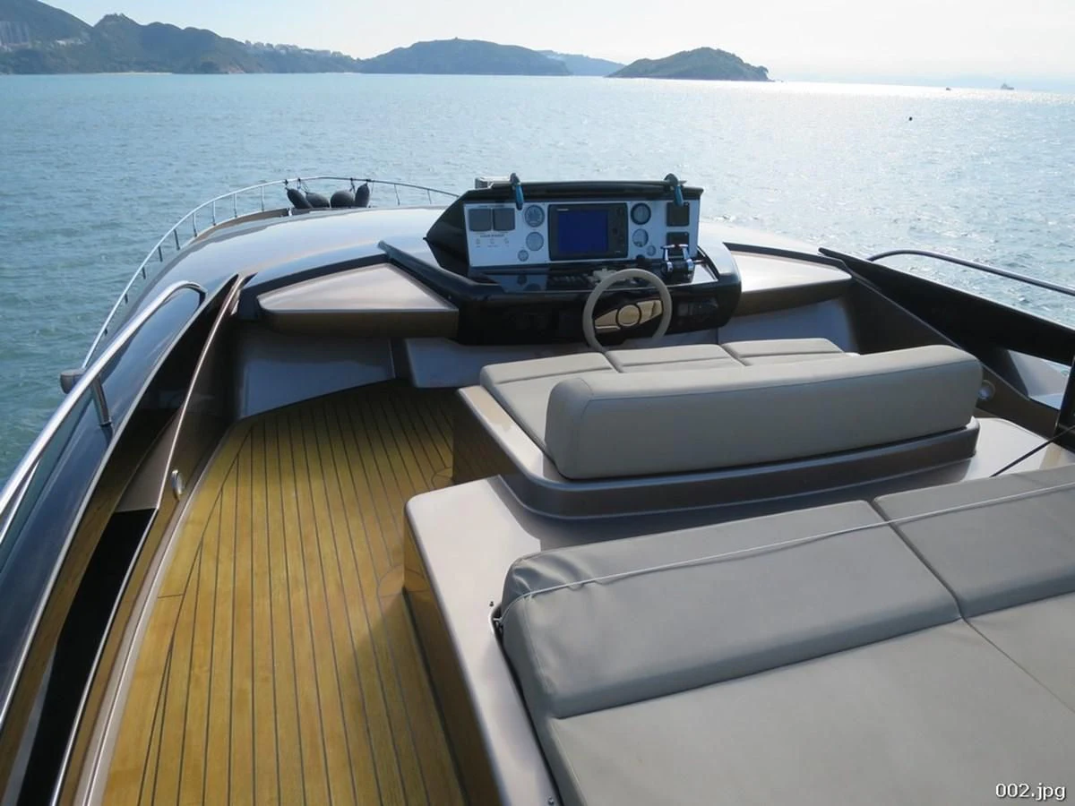a boat with a car on it aboard RIVA 86 DOMINO Yacht for Sale