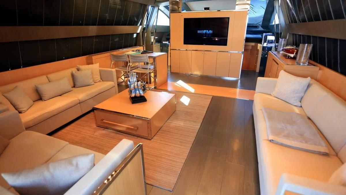 a room with couches and a television aboard LET MY PEOPLE GO Yacht for Sale