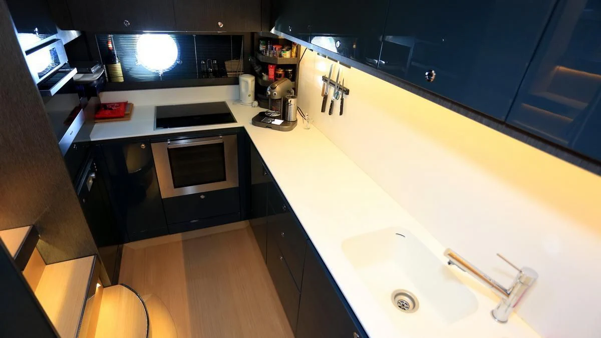 a kitchen with a sink and a microwave aboard LET MY PEOPLE GO Yacht for Sale