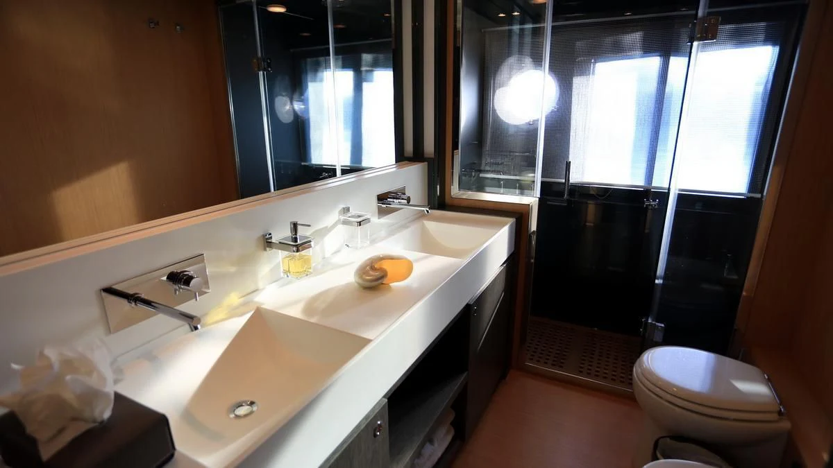 a bathroom with a sink and a toilet aboard LET MY PEOPLE GO Yacht for Sale
