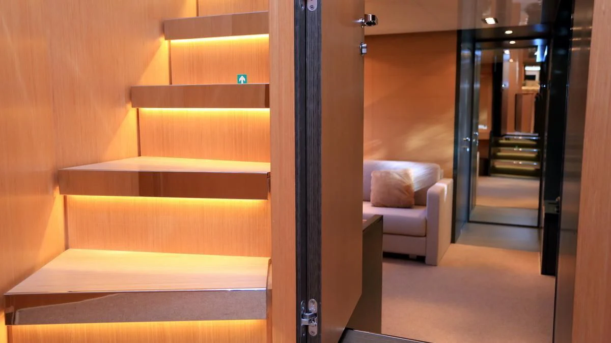 a room with a couch and a chair aboard LET MY PEOPLE GO Yacht for Sale