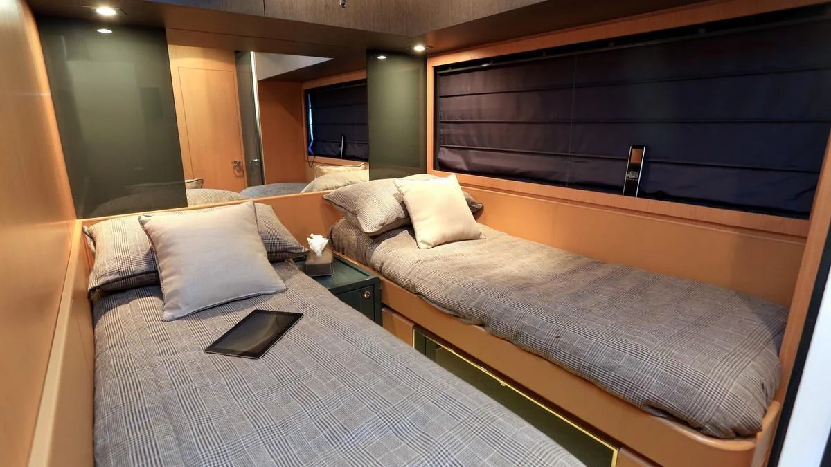 a bed with a laptop on it aboard LET MY PEOPLE GO Yacht for Sale