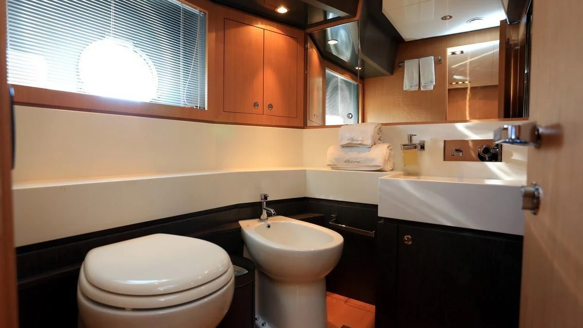 a bathroom with a sink toilet and a bathtub aboard LET MY PEOPLE GO Yacht for Sale