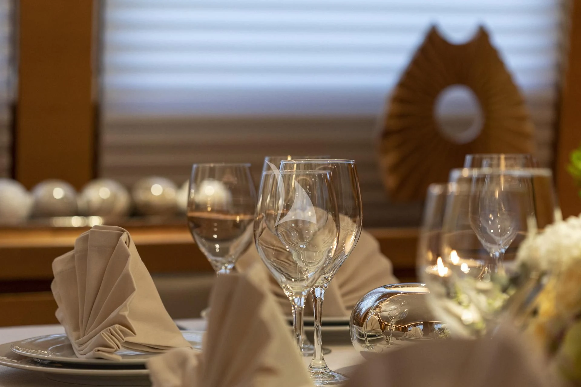 a table with wine glasses and food aboard SANSARA Yacht for Sale