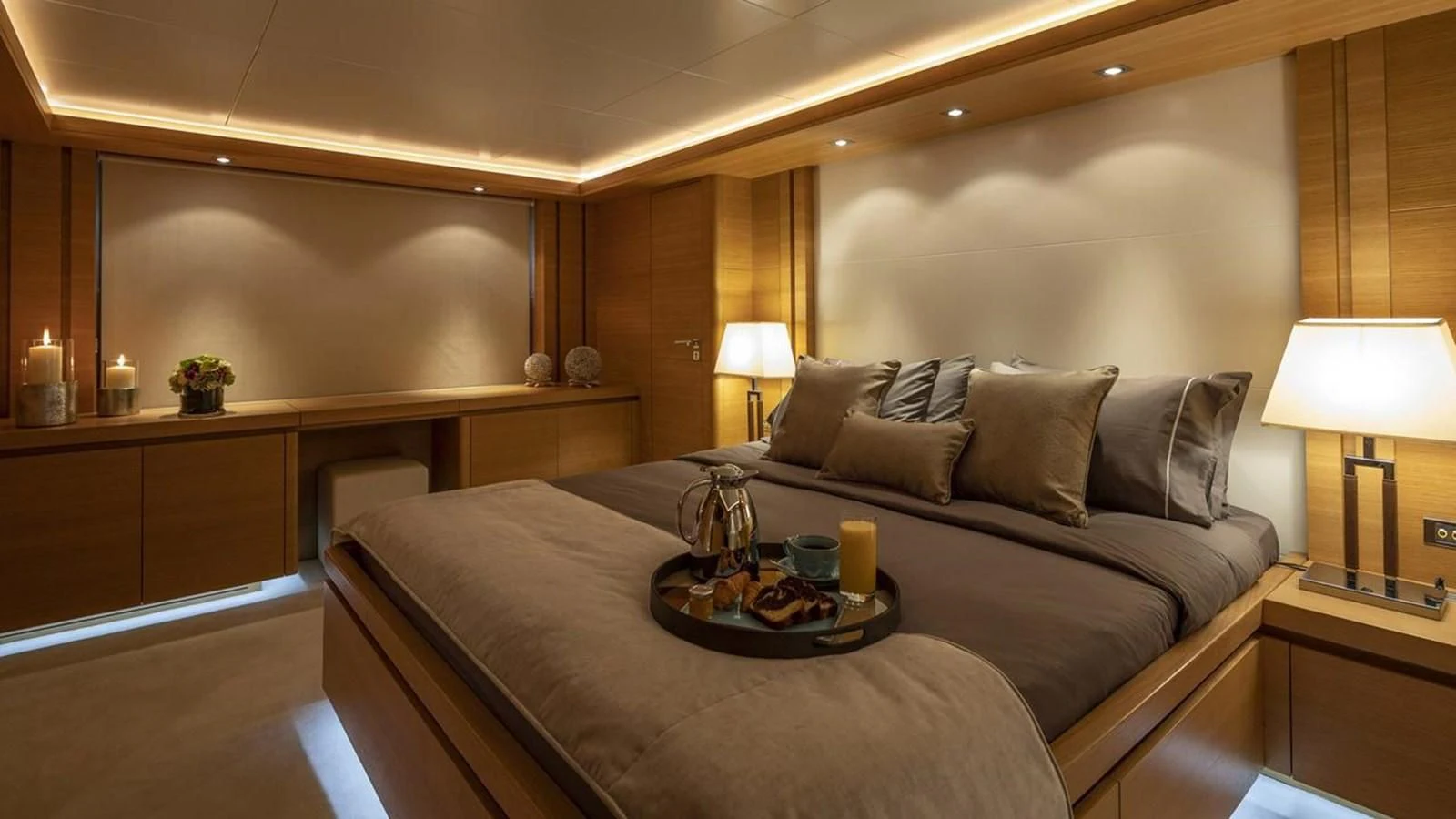 a hotel room with a bed and a table aboard SANSARA Yacht for Sale
