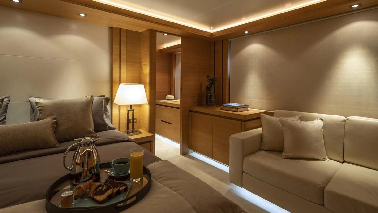 a living room with a couch and a coffee table aboard SANSARA Yacht for Sale
