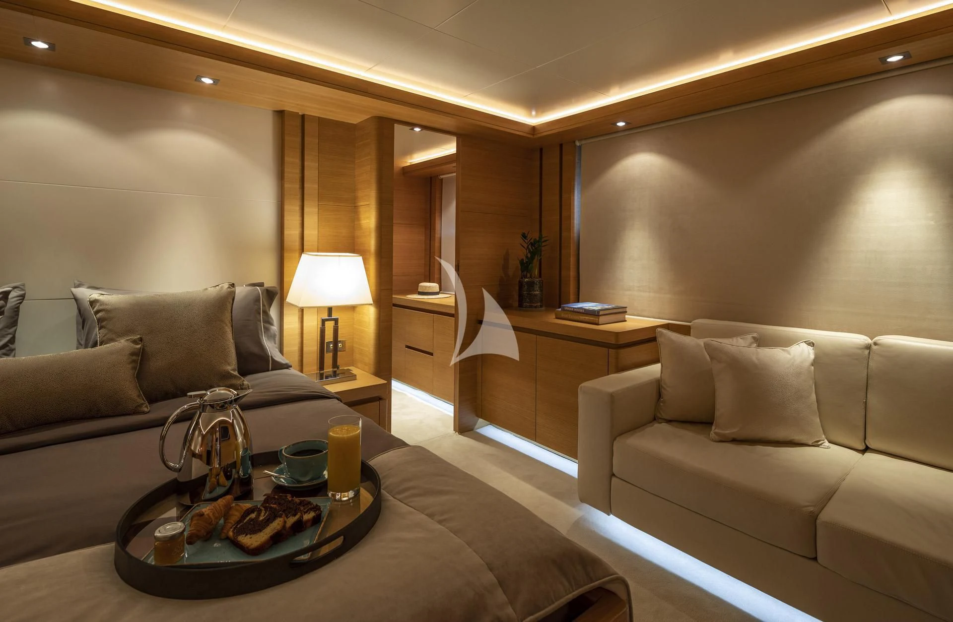 a living room with a couch and a coffee table aboard SANSARA Yacht for Sale