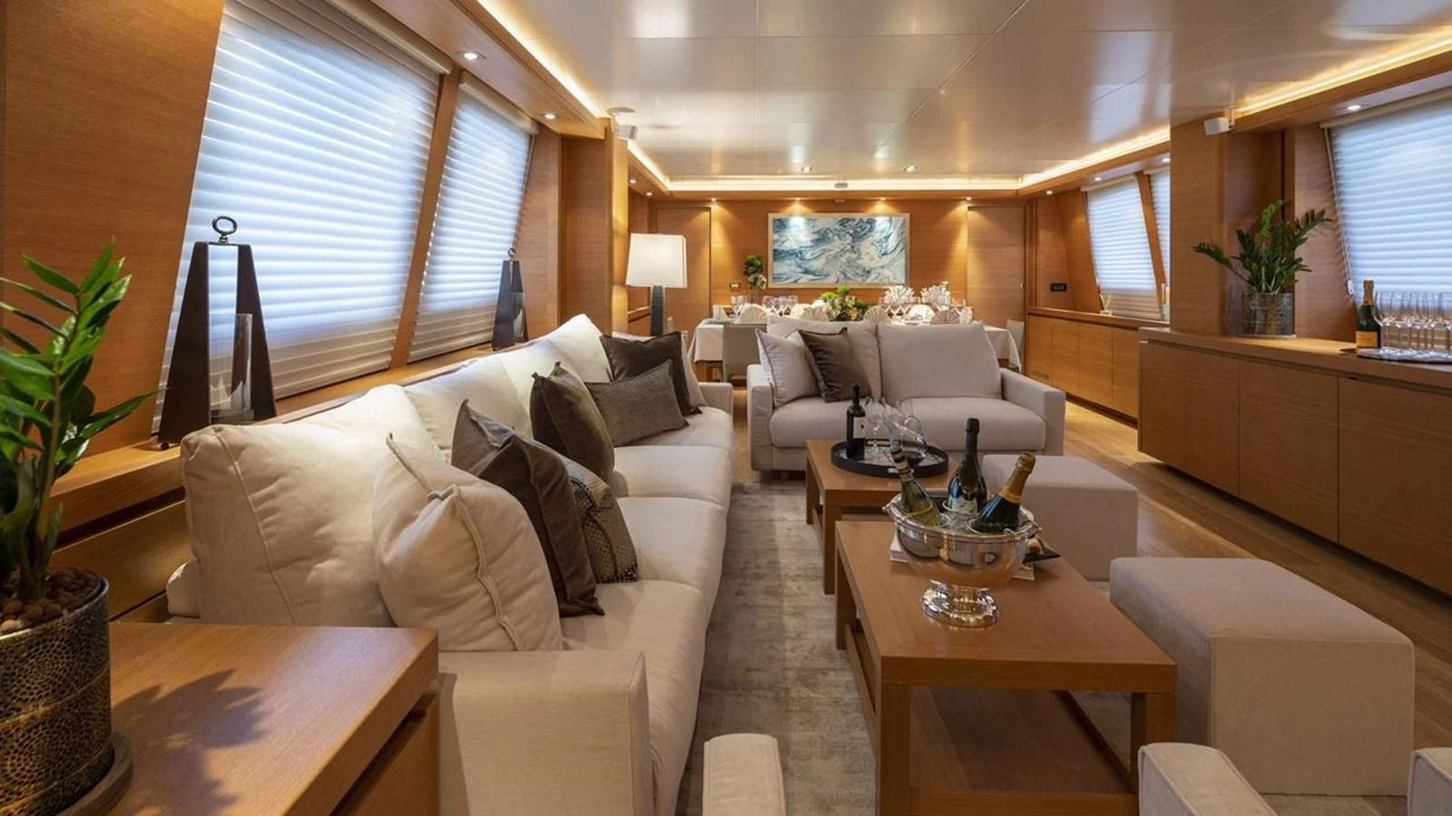 a living room with a couch and a table aboard SANSARA Yacht for Sale