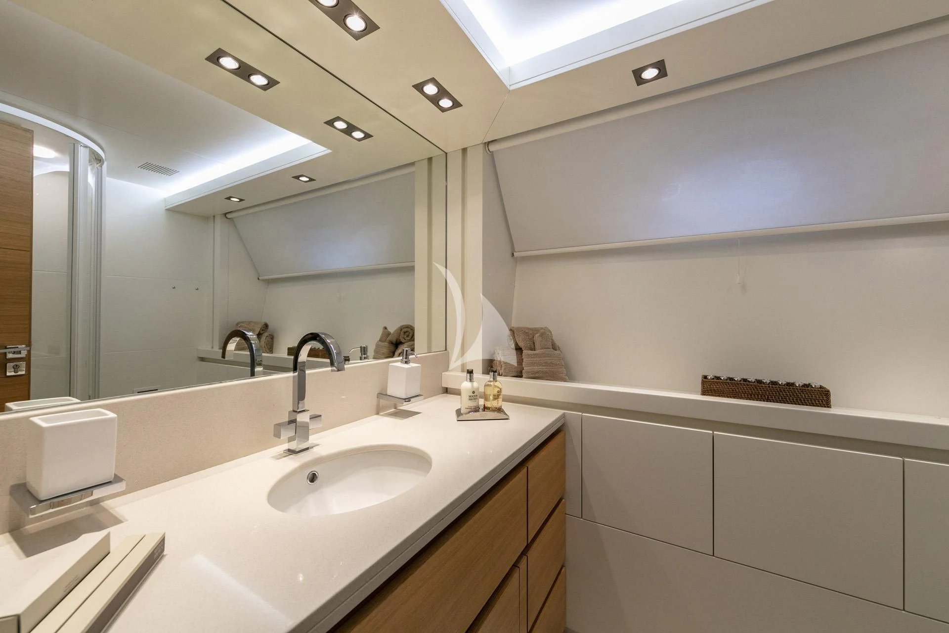 a bathroom with a large mirror aboard SANSARA Yacht for Sale
