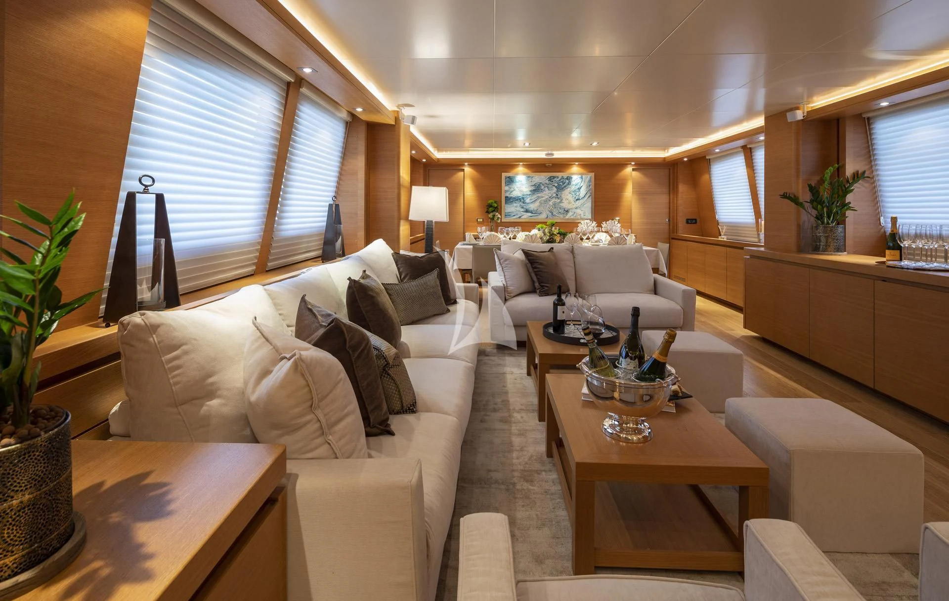 a living room with a couch and a table aboard SANSARA Yacht for Sale