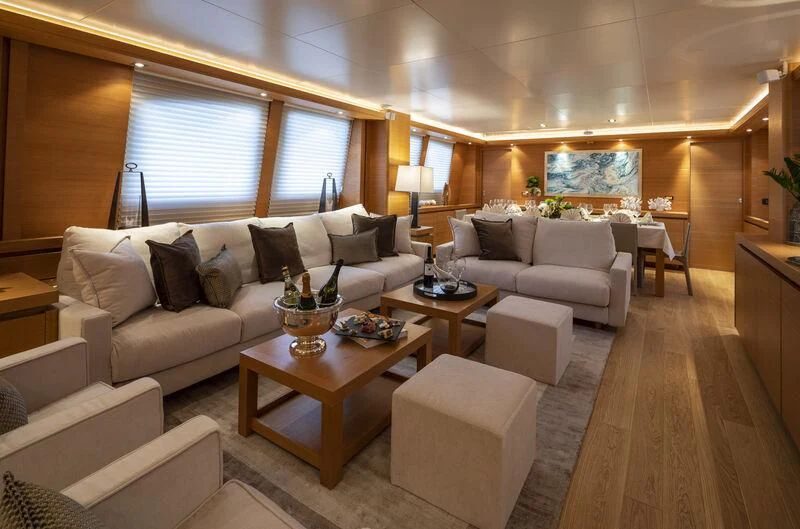 a living room with a couch and a coffee table aboard SANSARA Yacht for Sale