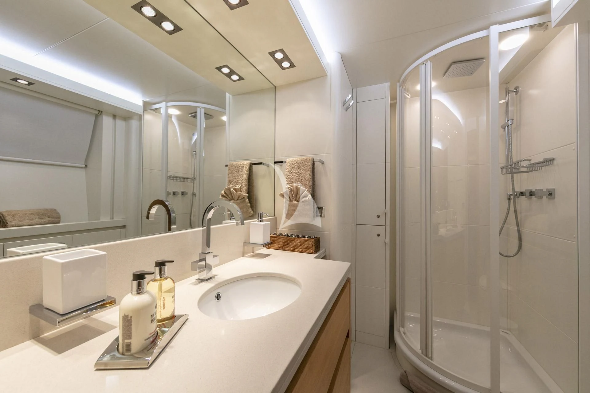 a bathroom with a glass shower aboard SANSARA Yacht for Sale