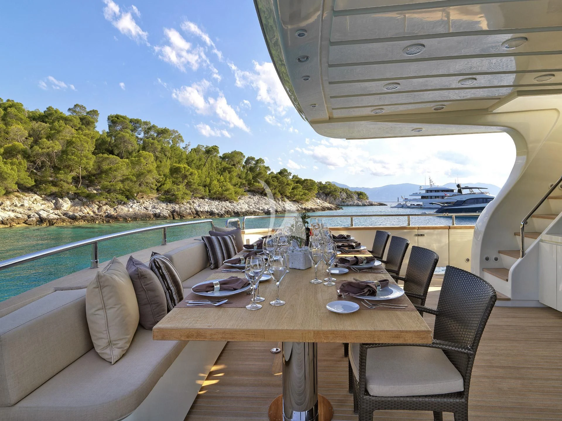 a table on a deck aboard SANSARA Yacht for Sale