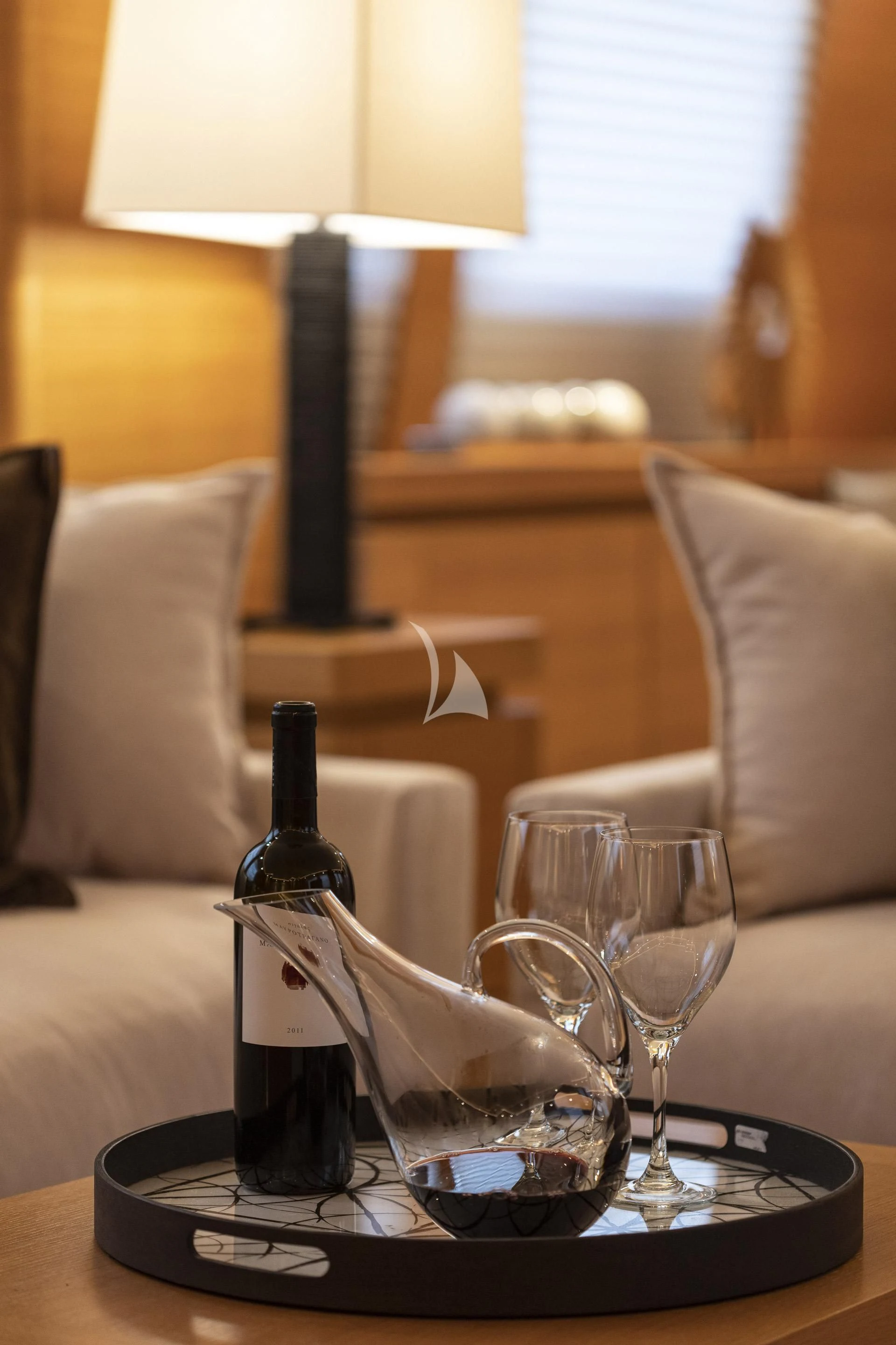 a glass of wine on a table aboard SANSARA Yacht for Sale
