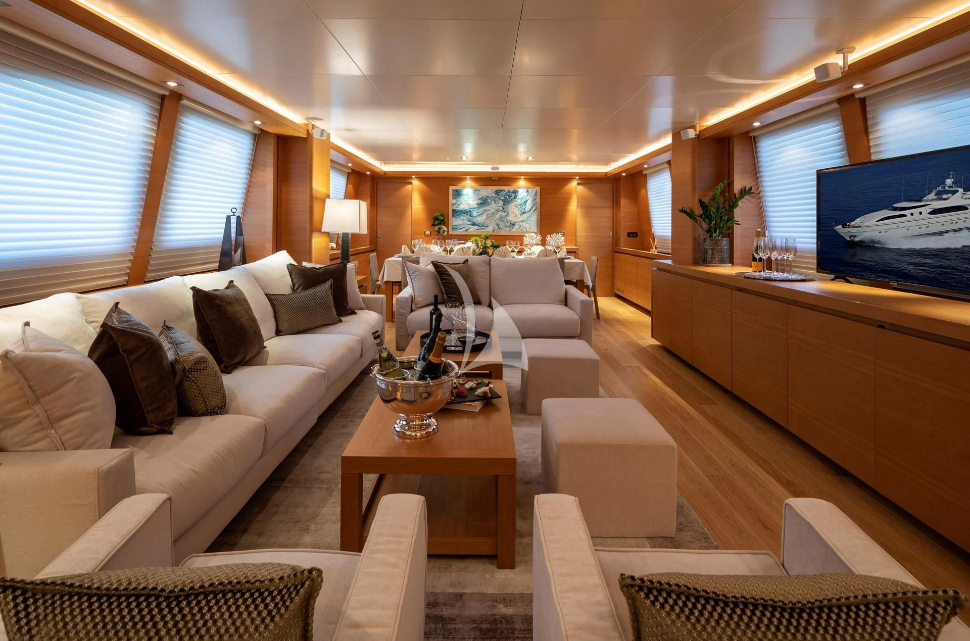 a living room with a large screen aboard SANSARA Yacht for Sale