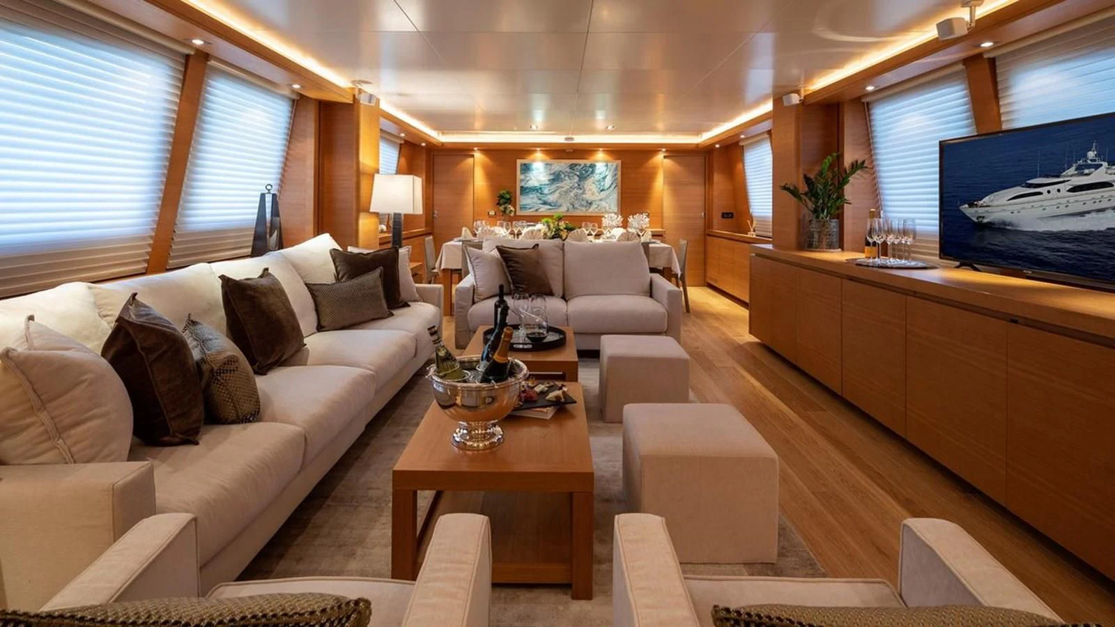 a living room with a large tv aboard SANSARA Yacht for Sale