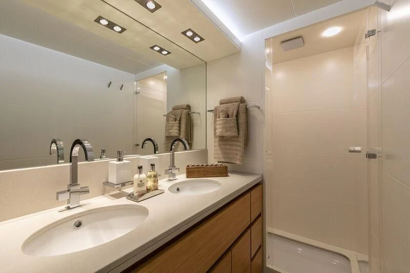 a bathroom with a sink and a shower aboard SANSARA Yacht for Sale
