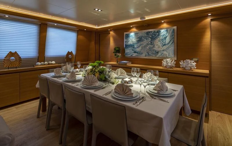 a dining table set for a dinner aboard SANSARA Yacht for Sale