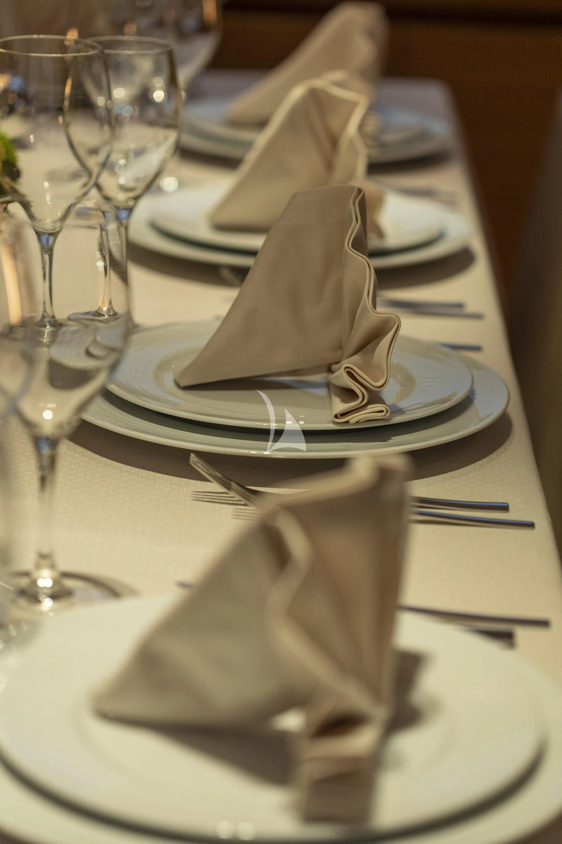 a table with napkins and glasses aboard SANSARA Yacht for Sale