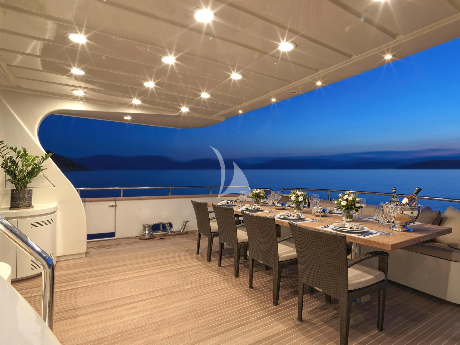a large room with a table and chairs aboard SANSARA Yacht for Sale