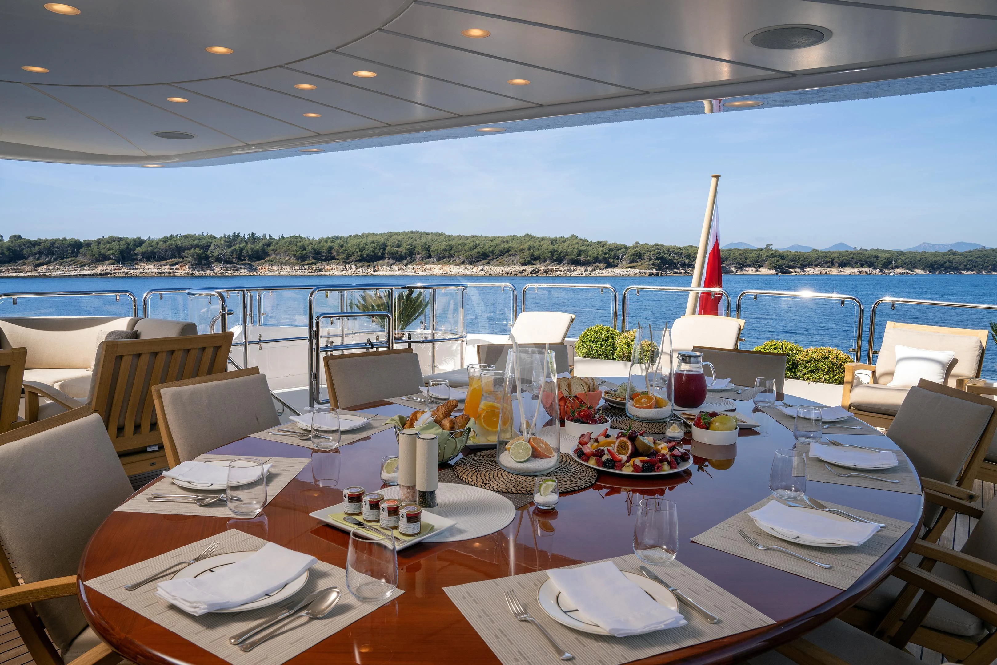 a table set with plates and glasses aboard MI AMORE JULIA Yacht for Sale