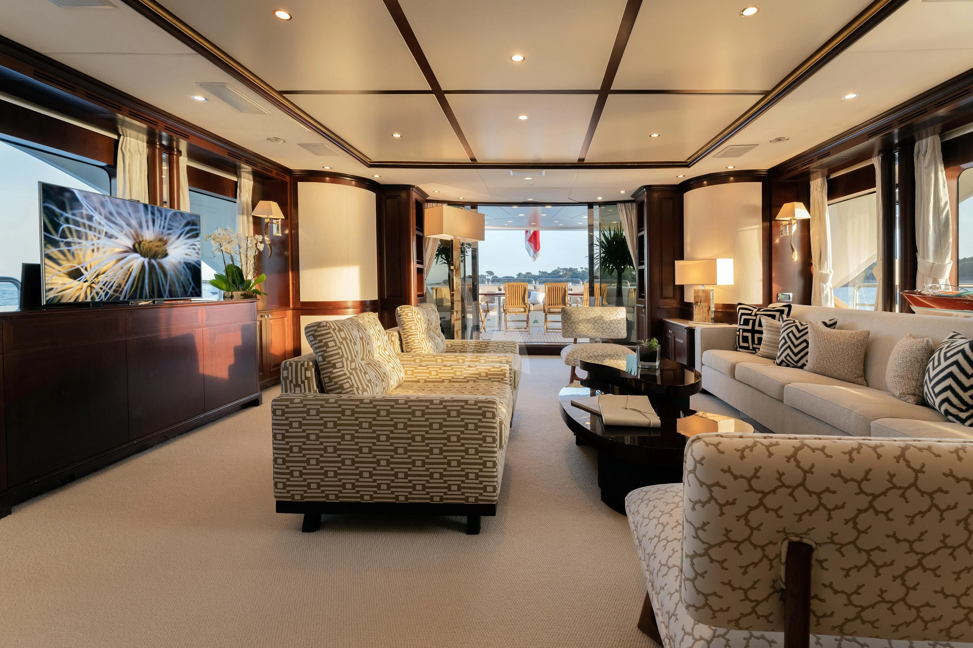 a living room with a large screen aboard MI AMORE JULIA Yacht for Sale