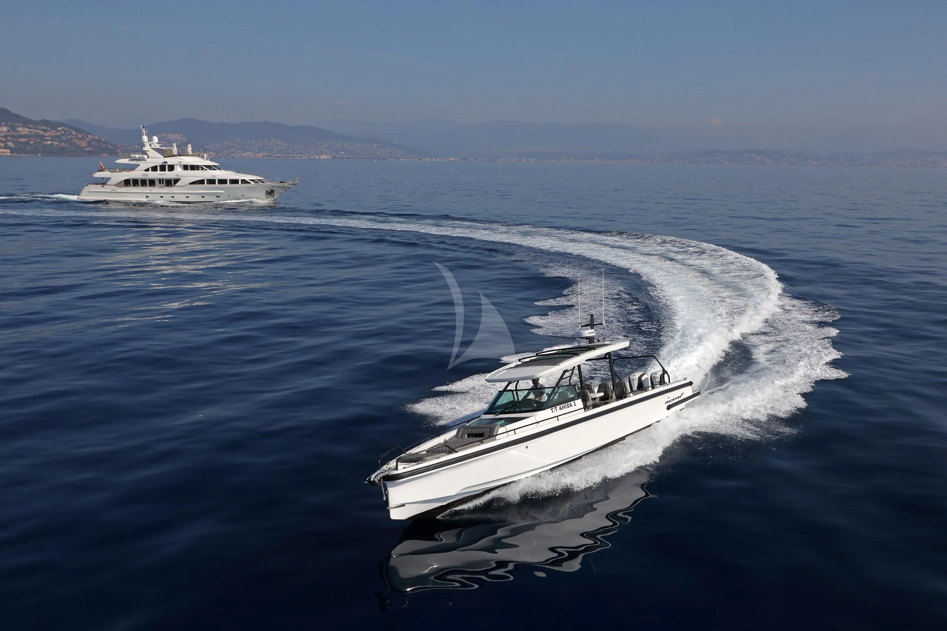 a couple of boats on the water aboard MI AMORE JULIA Yacht for Sale