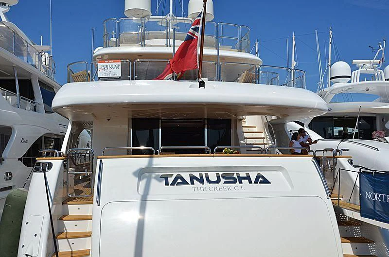 a boat with a flag on the front aboard MI AMORE JULIA Yacht for Sale