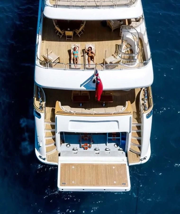 a boat with a couple of people on it aboard MI AMORE JULIA Yacht for Sale