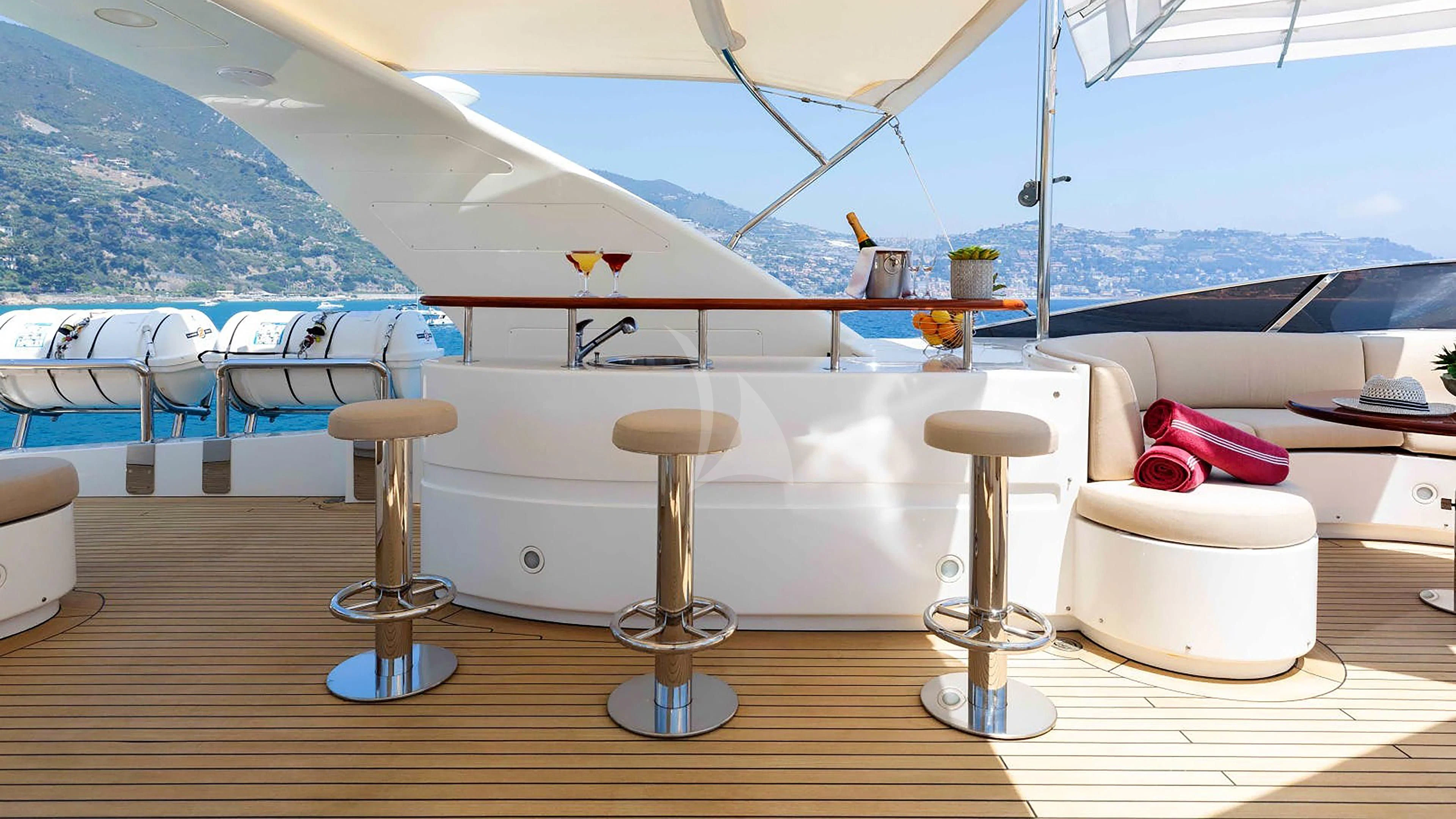 a table with stools on it aboard MI AMORE JULIA Yacht for Sale