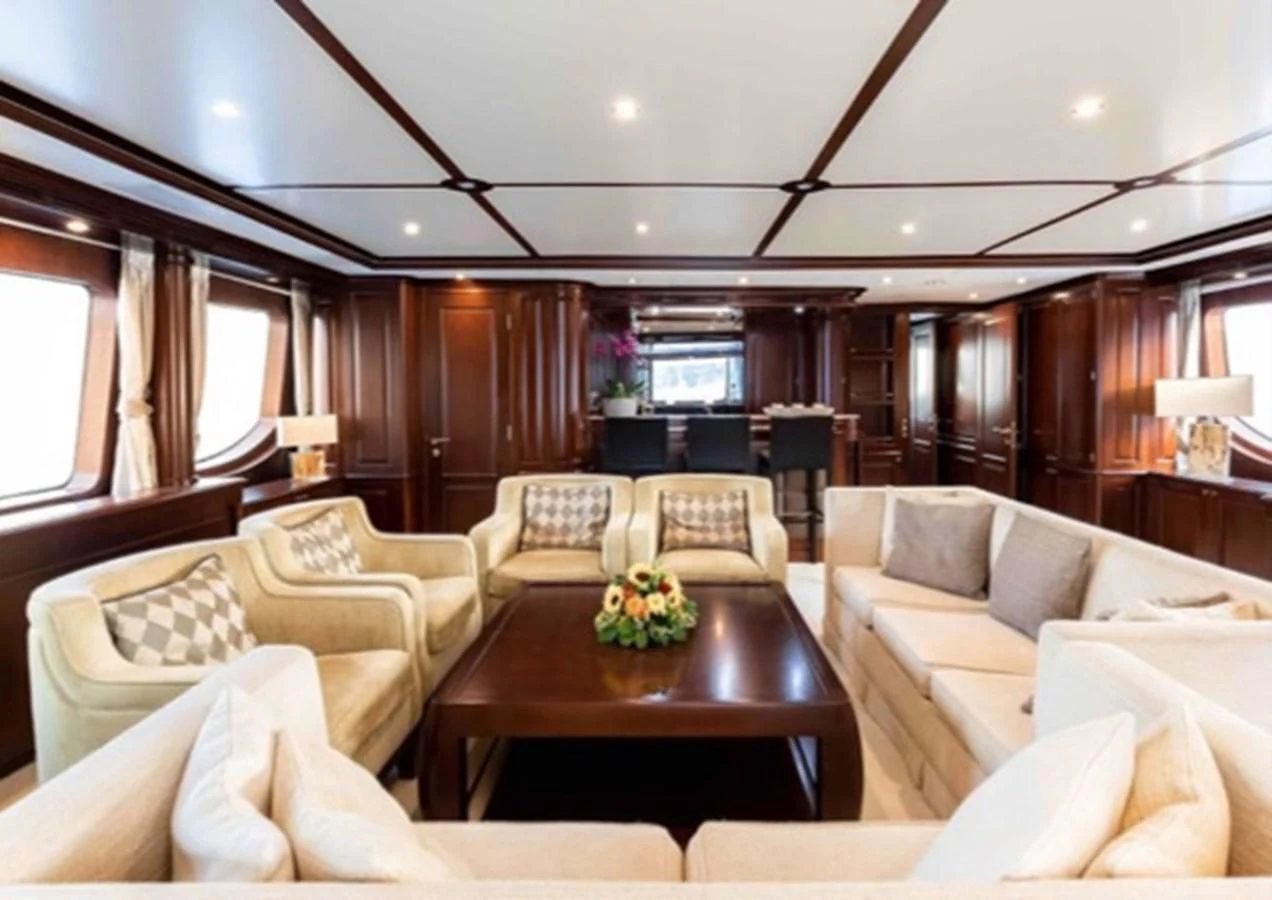 a living room with couches and a table aboard MI AMORE JULIA Yacht for Sale