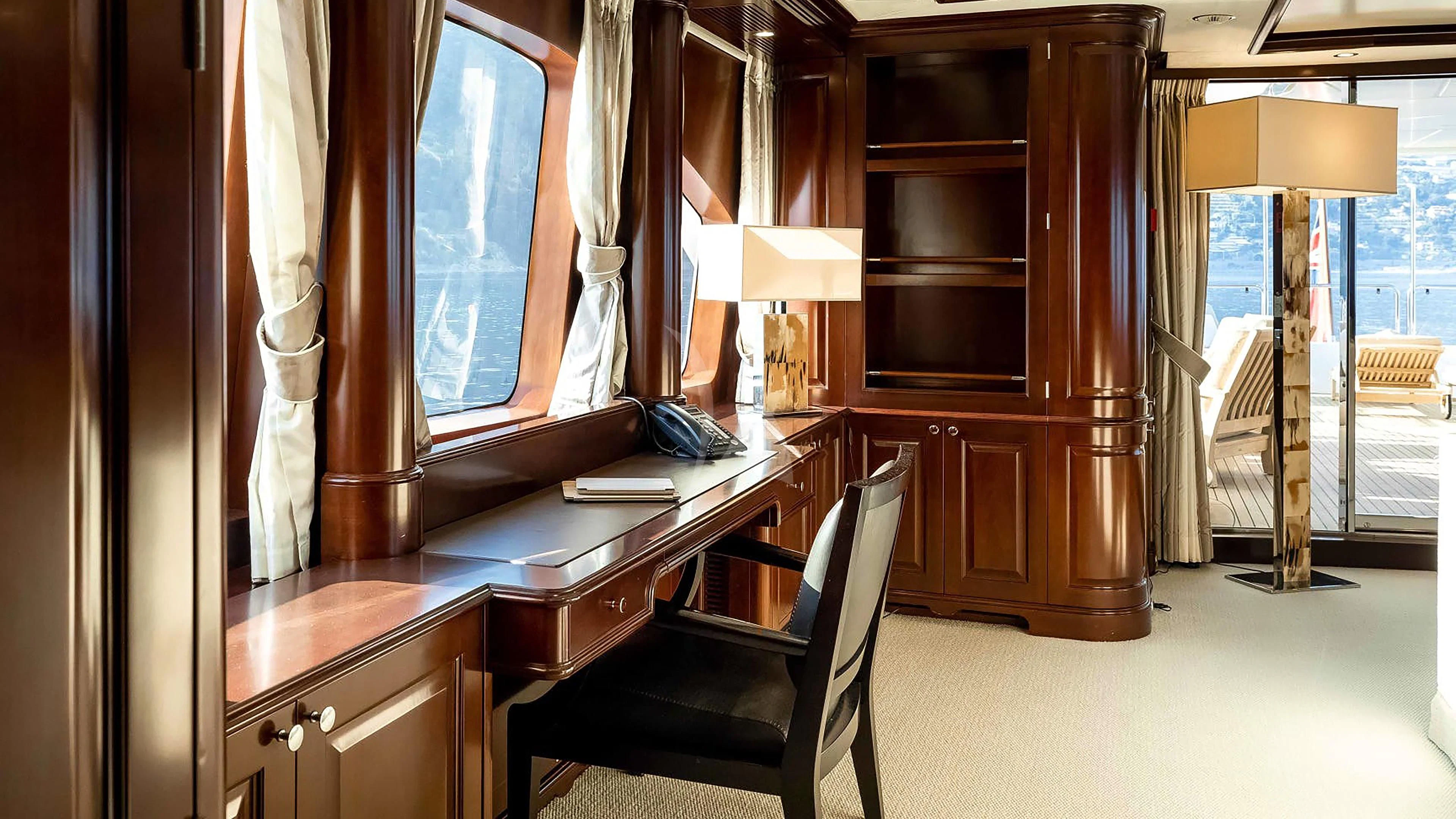 a room with a desk and a chair aboard MI AMORE JULIA Yacht for Sale