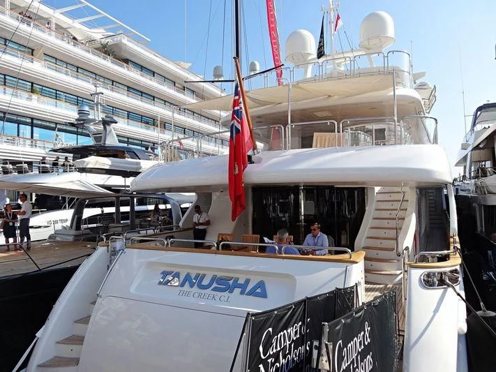 a boat with a flag on the front aboard MI AMORE JULIA Yacht for Sale