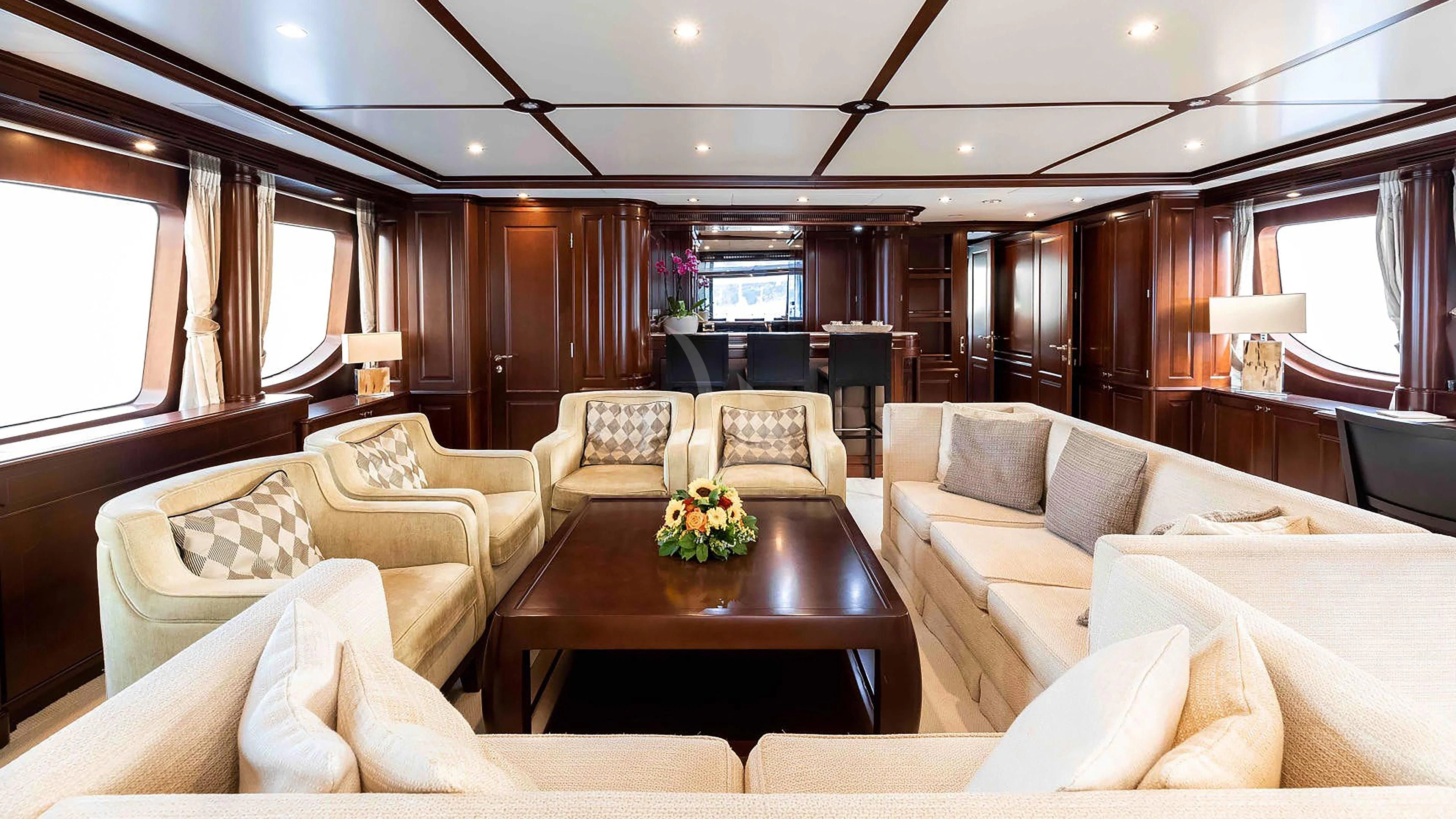 a living room with a couch and a table aboard MI AMORE JULIA Yacht for Sale