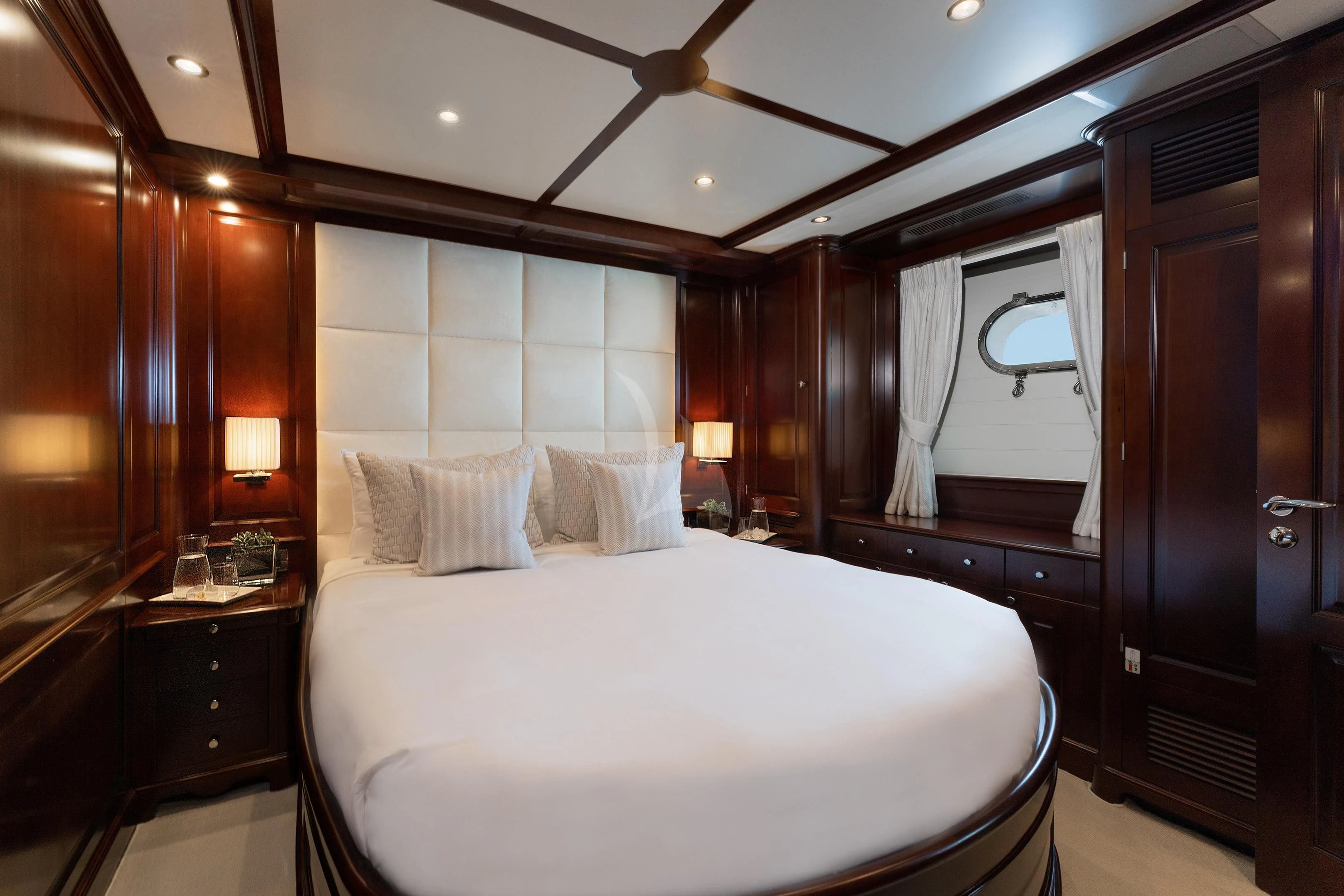 a large bedroom with a large mirror aboard MI AMORE JULIA Yacht for Sale