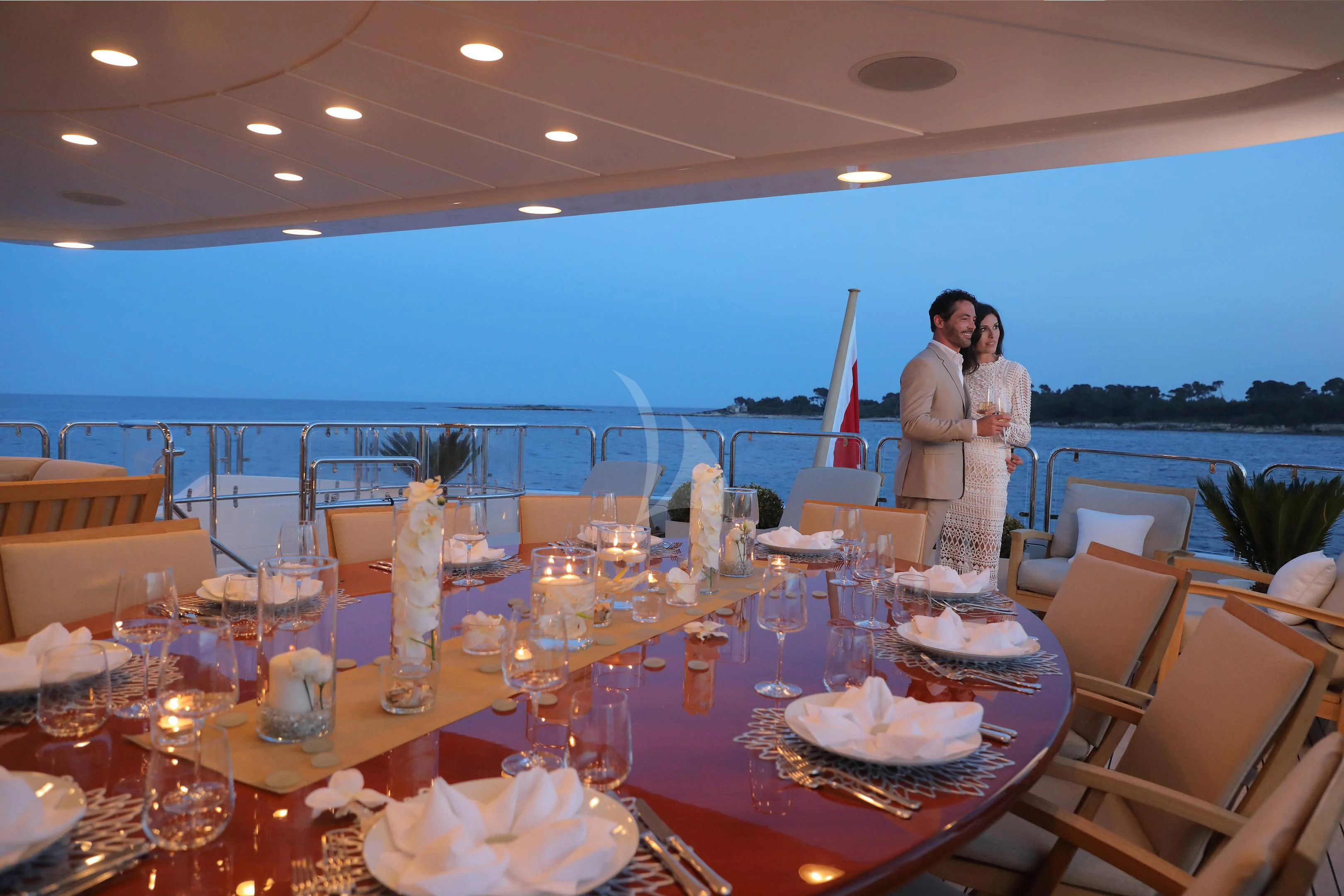 a table with plates and glasses on it aboard MI AMORE JULIA Yacht for Sale
