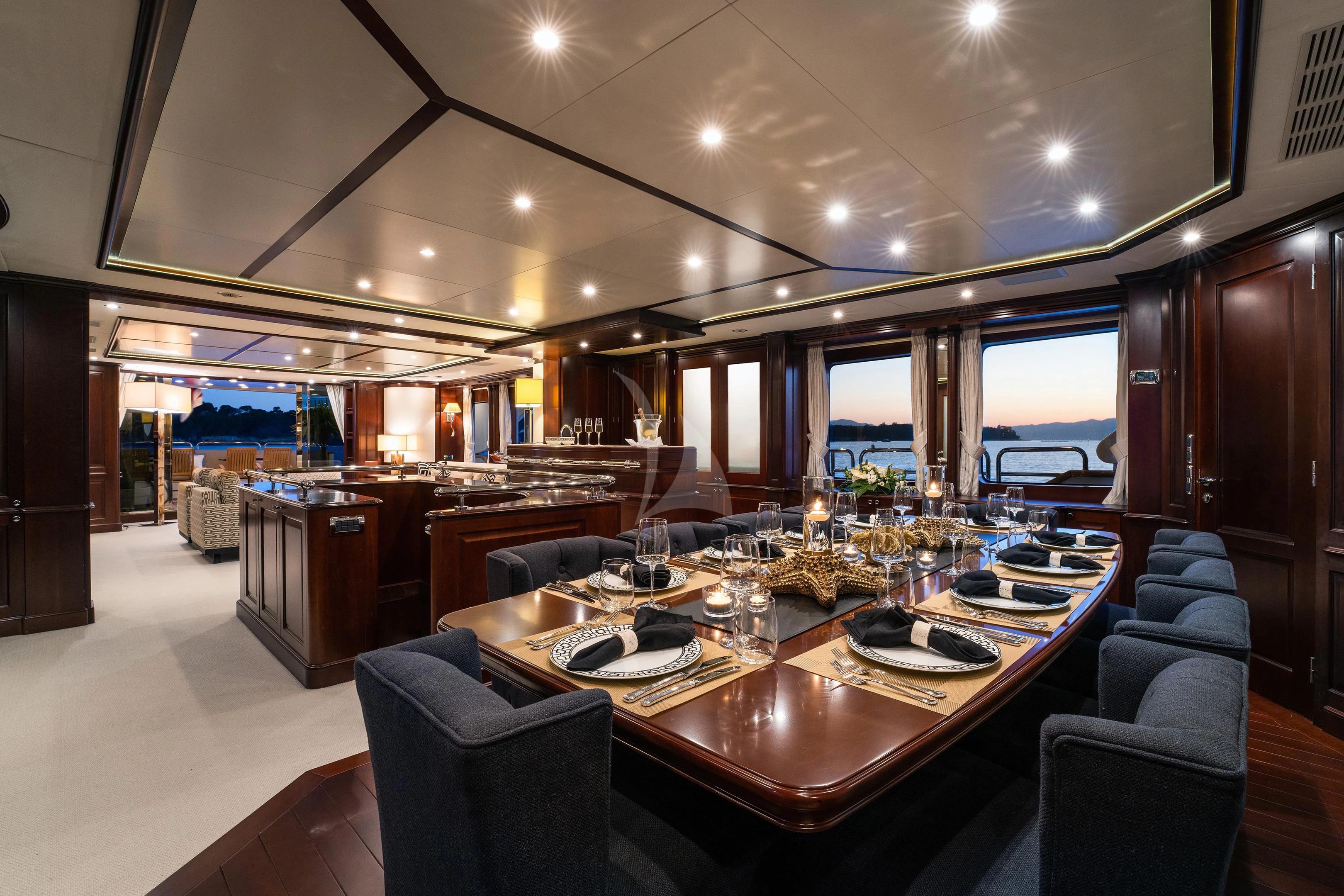 a large kitchen with a large dining table aboard MI AMORE JULIA Yacht for Sale