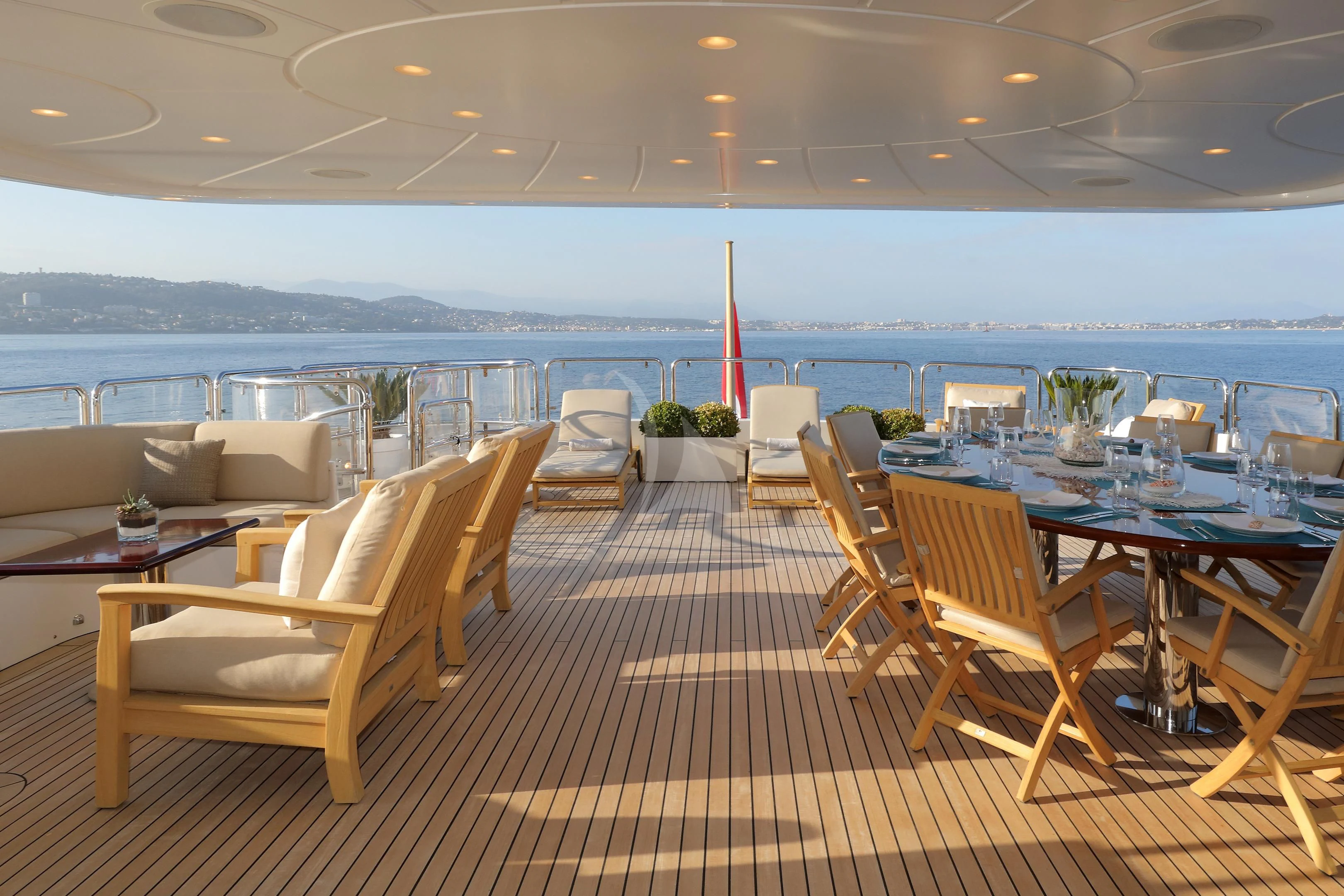 a room with tables and chairs aboard MI AMORE JULIA Yacht for Sale