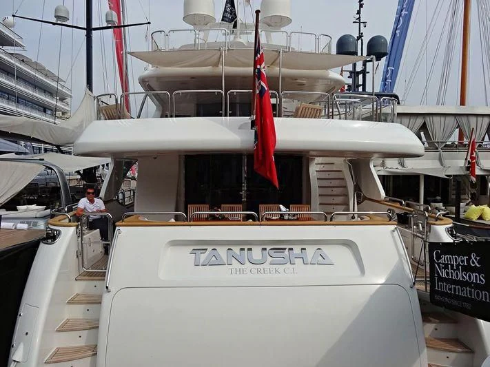 a boat with a flag on the front aboard MI AMORE JULIA Yacht for Sale