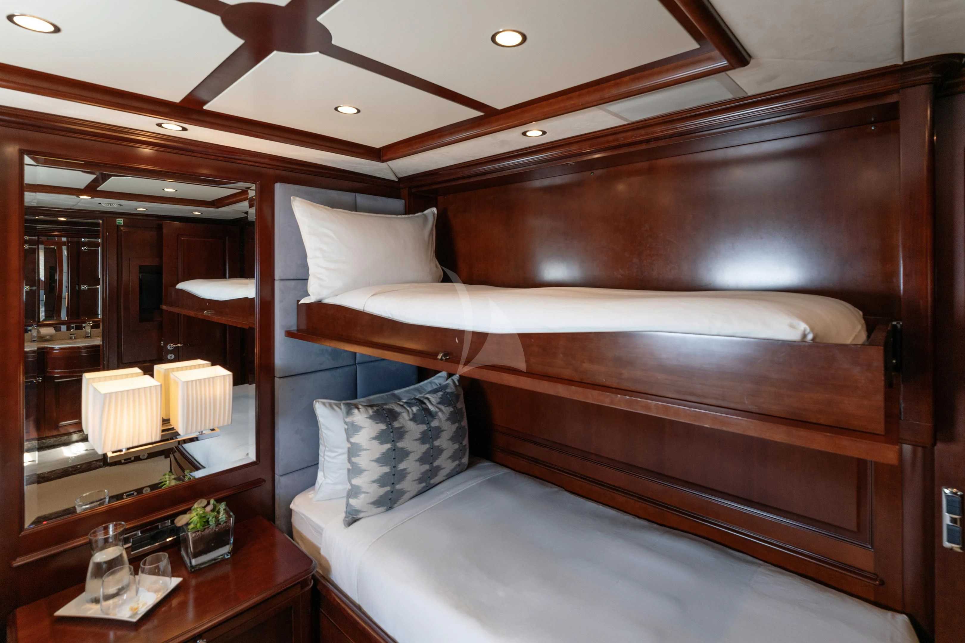 a bed with a wooden headboard aboard MI AMORE JULIA Yacht for Sale