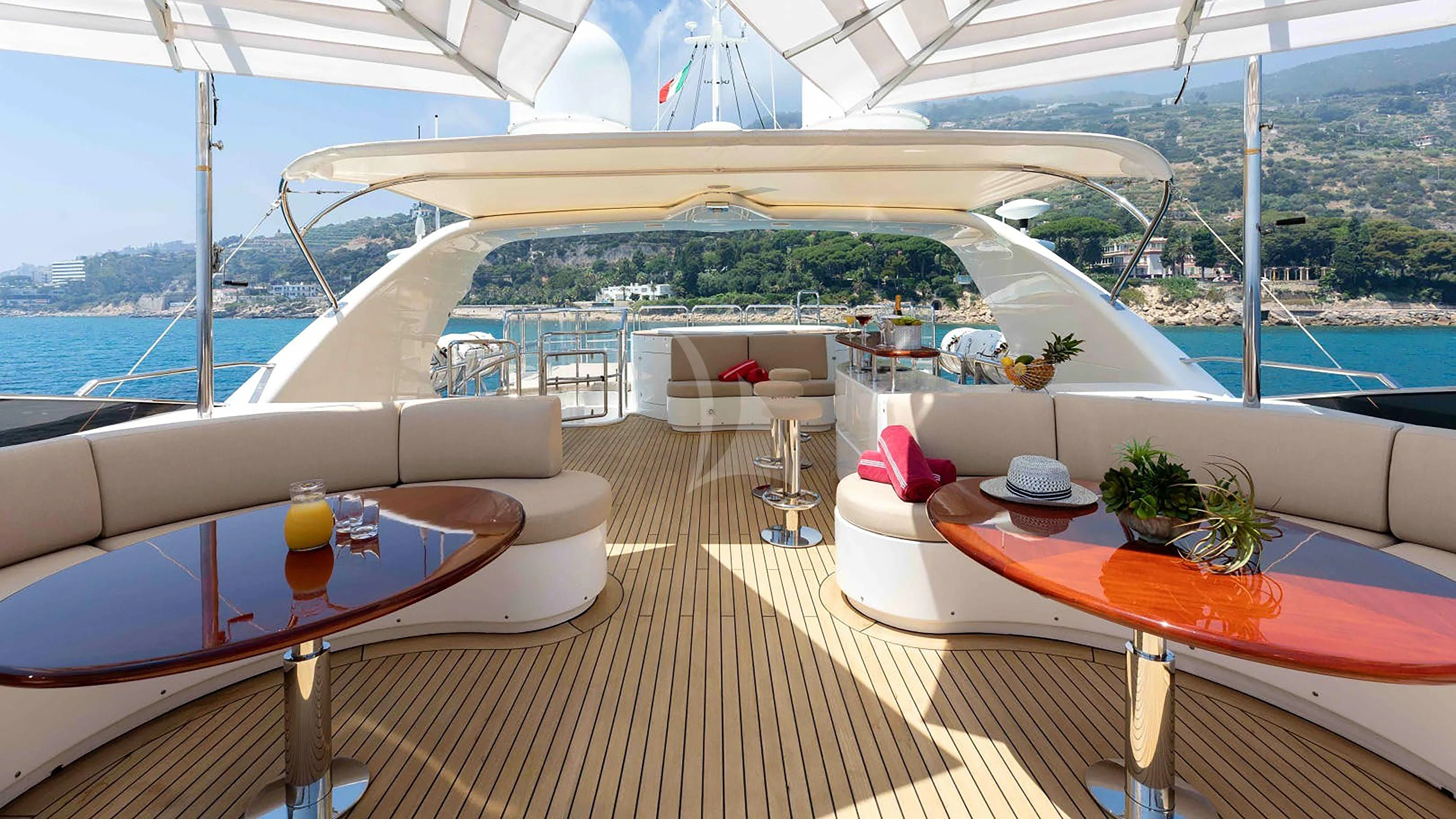 a deck with a view of the ocean and a large building aboard MI AMORE JULIA Yacht for Sale