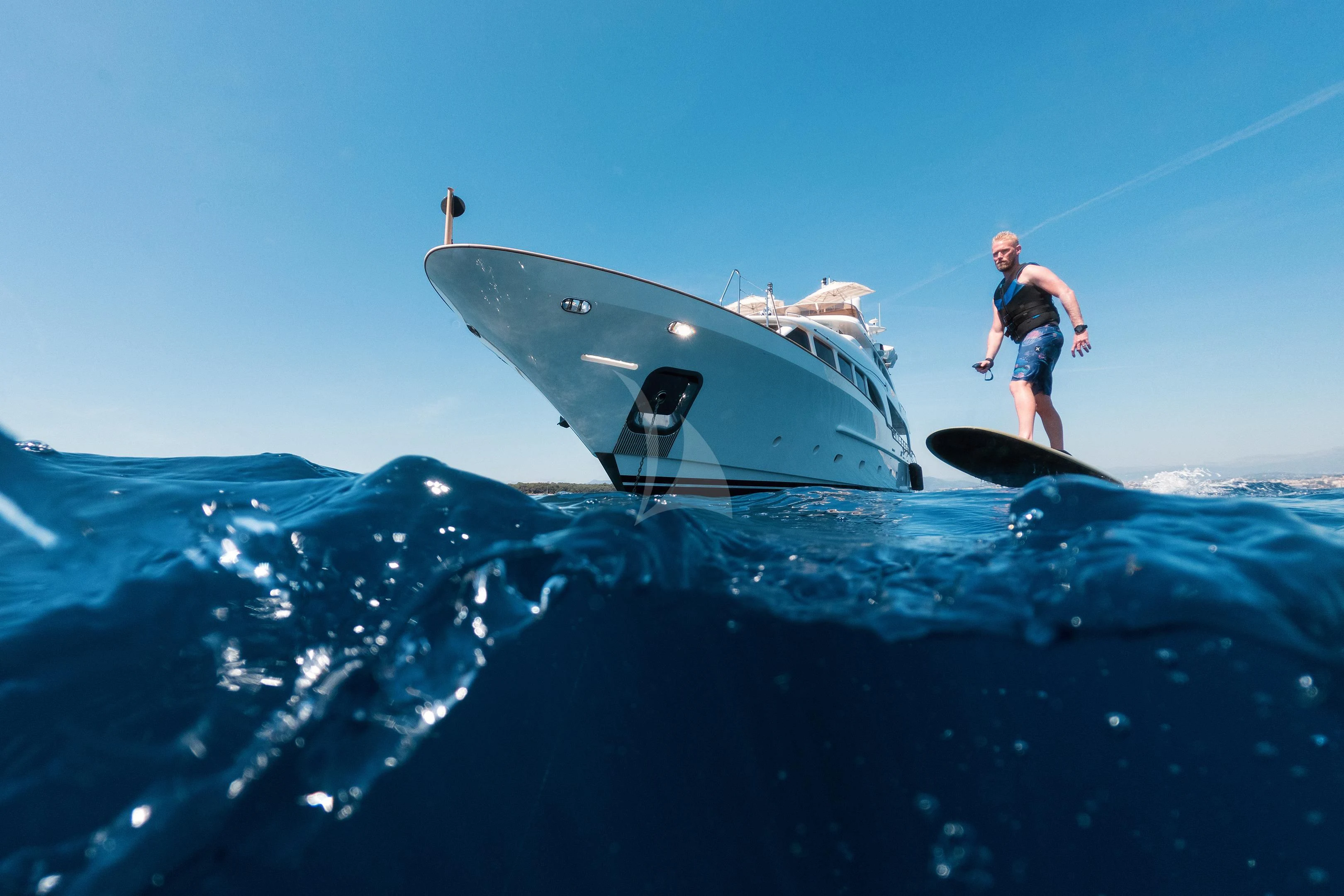 a man jumping off a boat aboard MI AMORE JULIA Yacht for Sale