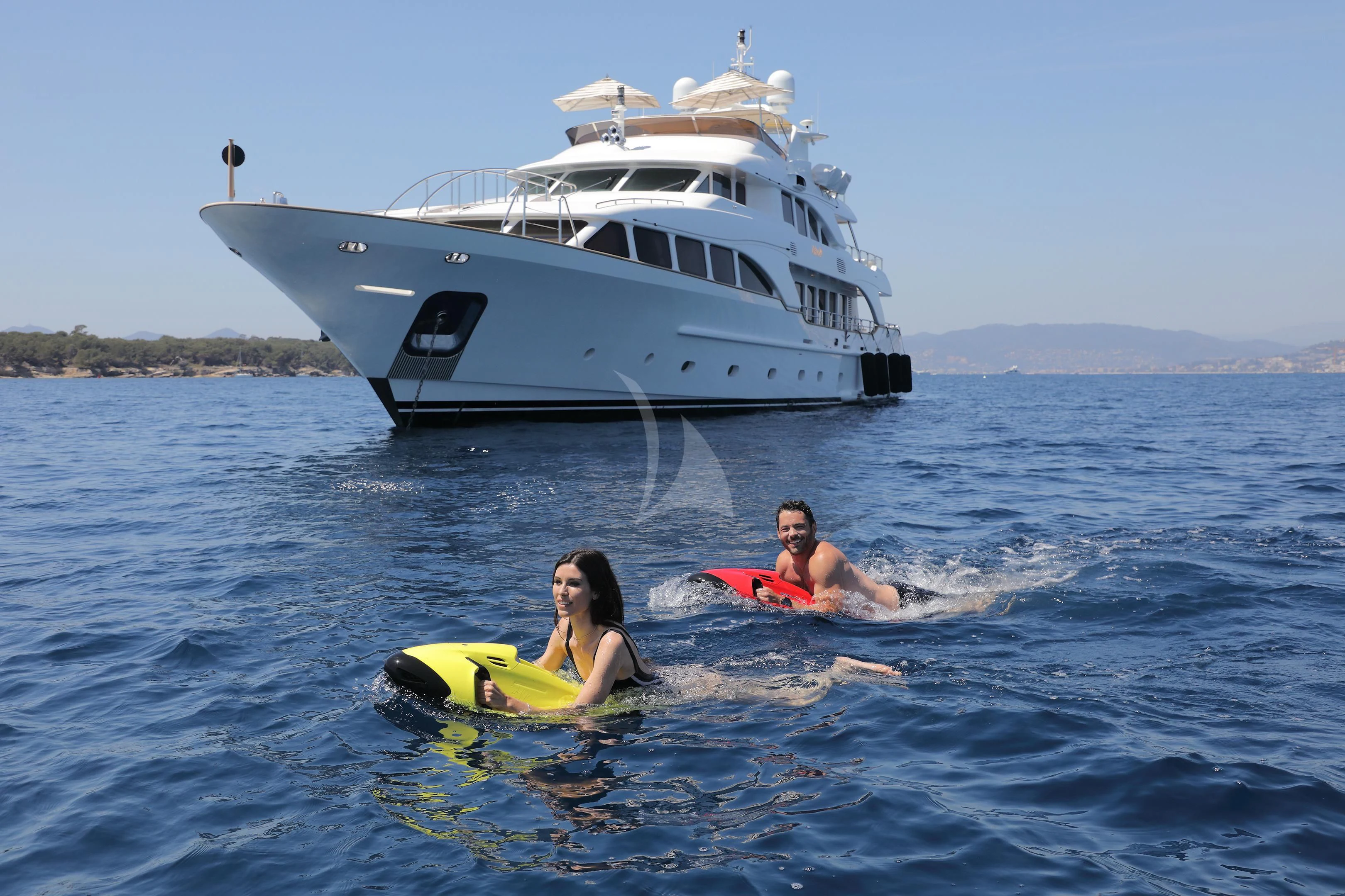 a couple of people on surfboards in the water aboard MI AMORE JULIA Yacht for Sale