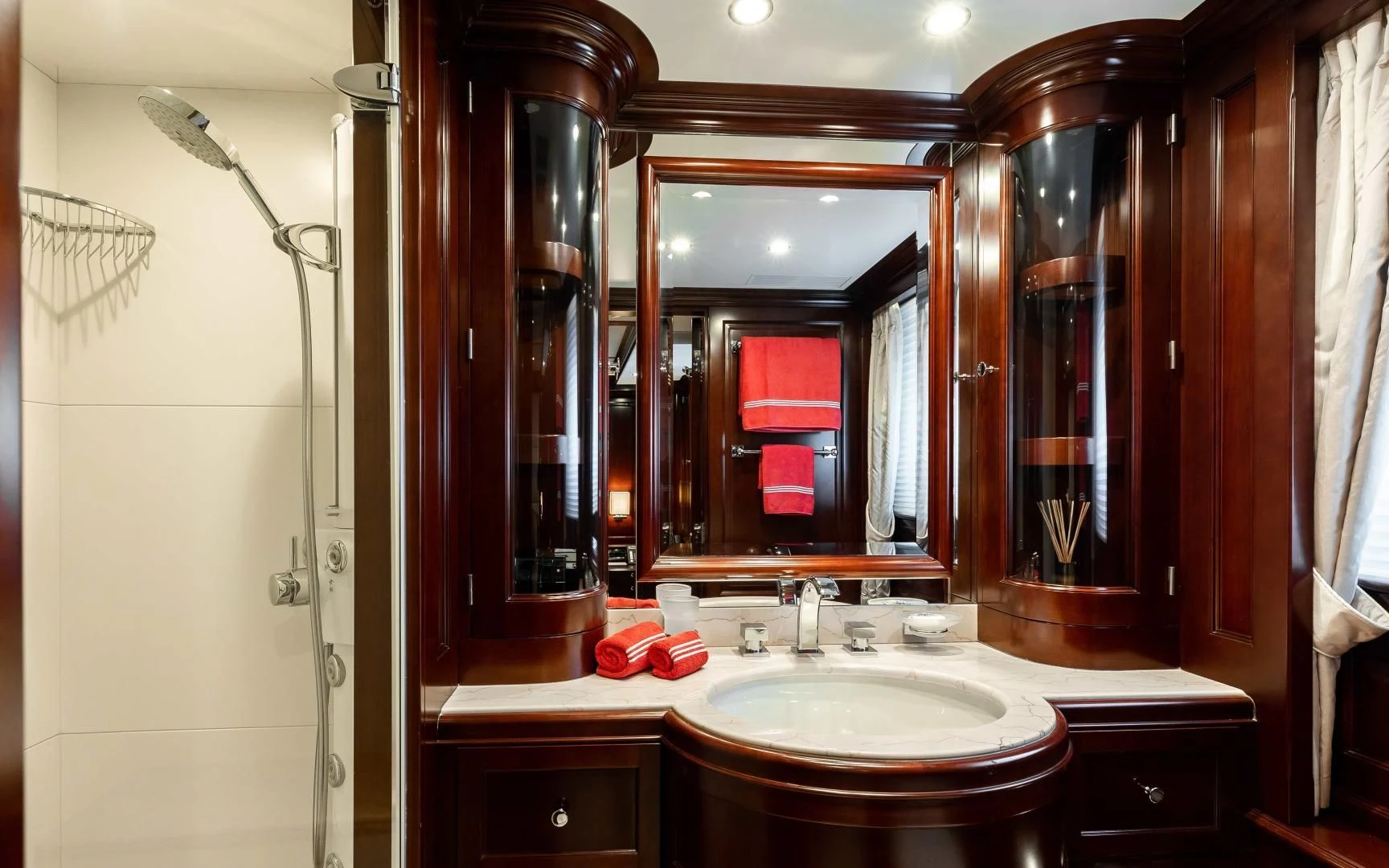 a bathroom with a large mirror aboard MI AMORE JULIA Yacht for Sale