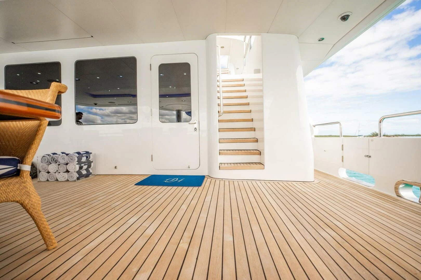 a room with a white door and a wood floor aboard ISLAND HEIRESS Yacht for Charter