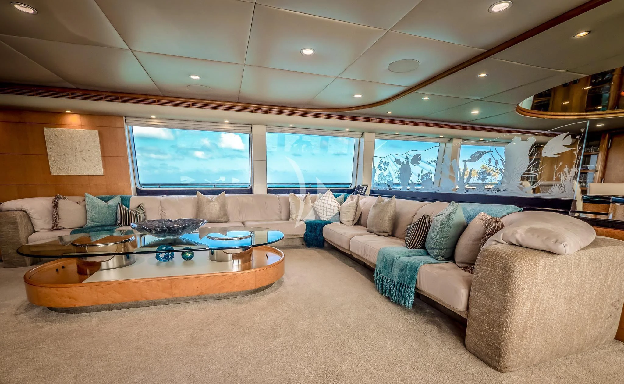 a living room with a large screen aboard ISLAND HEIRESS Yacht for Charter