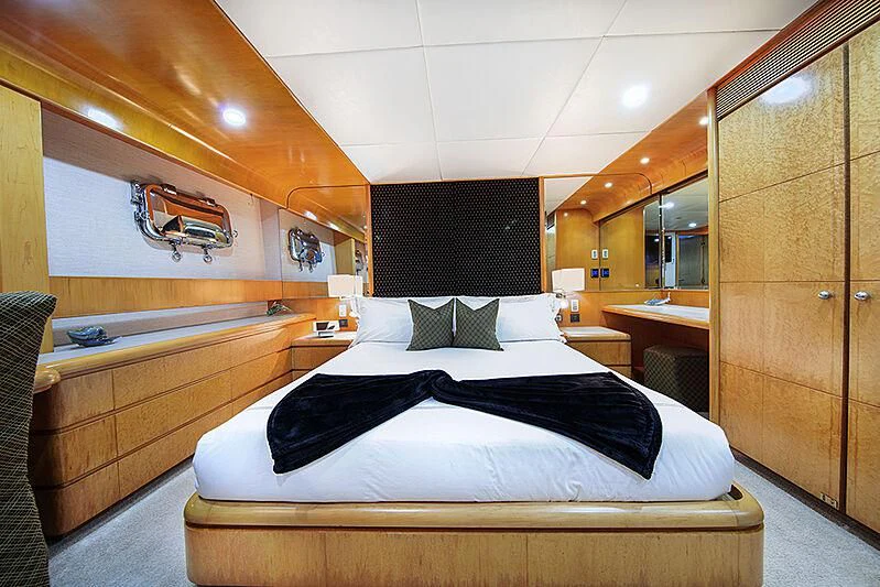 a room with a bed and a desk aboard ISLAND HEIRESS Yacht for Charter