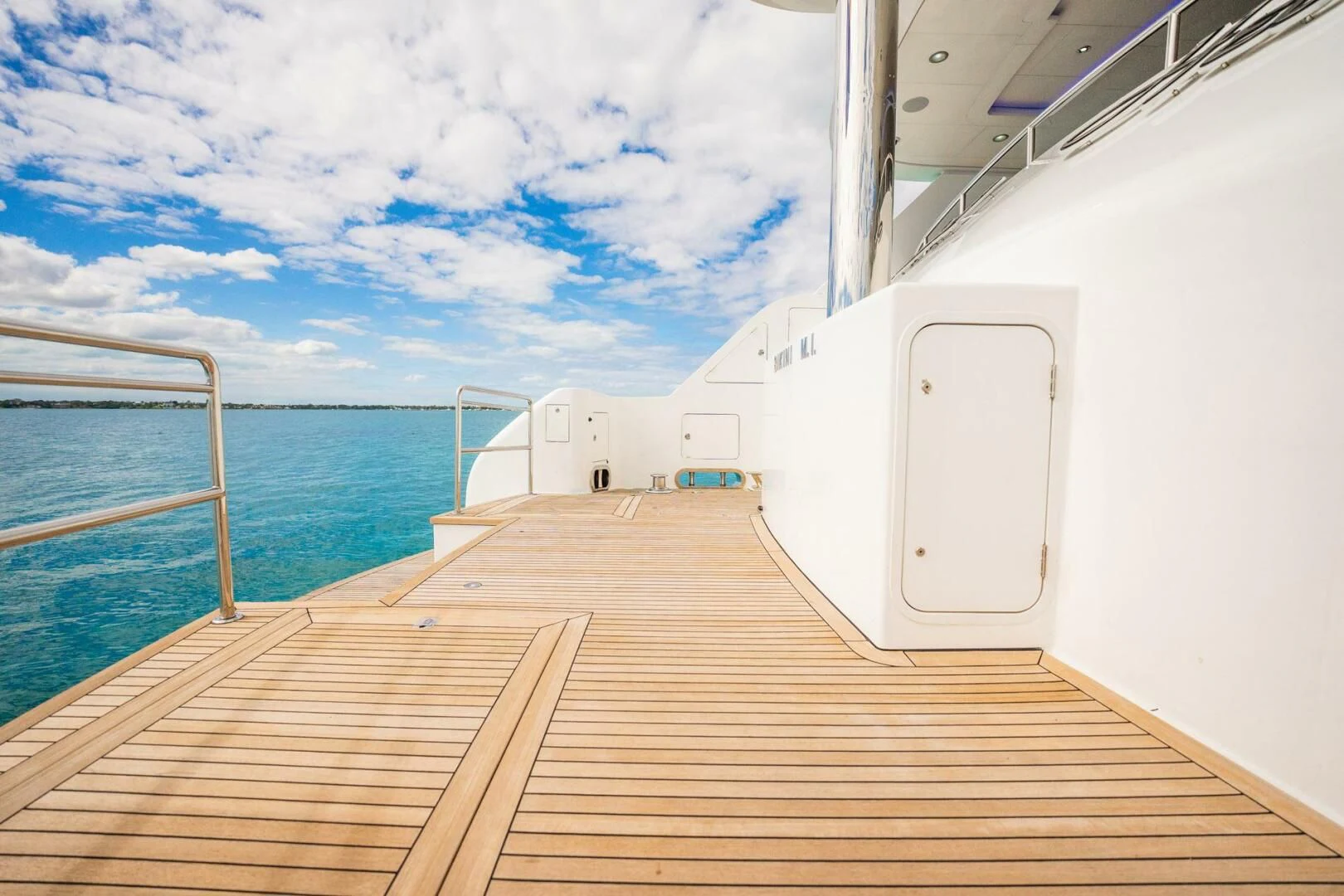 a wooden dock leading to a boat aboard ISLAND HEIRESS Yacht for Charter