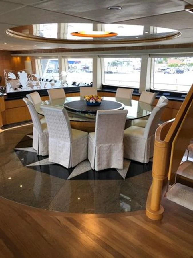 a dining room with a table and chairs aboard ISLAND HEIRESS Yacht for Charter